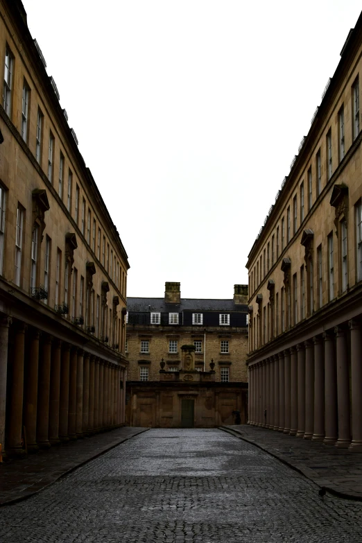 the stone street leads to a large building