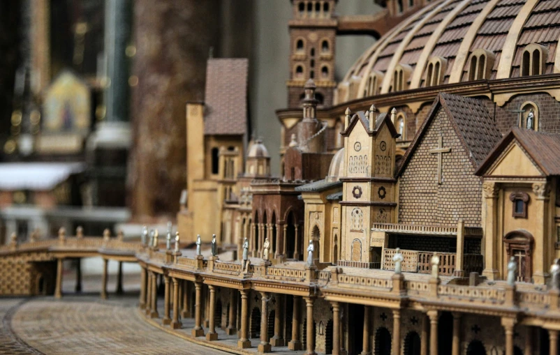 a close up of a small model building with other buildings