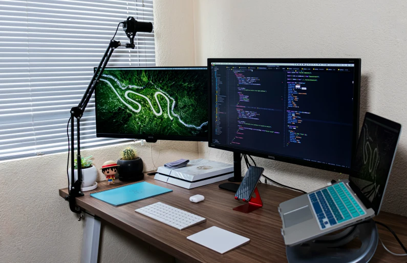 two computer monitors with the same logo and numbers on them