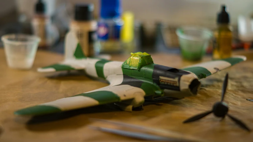 a toy fighter plane laying on the table