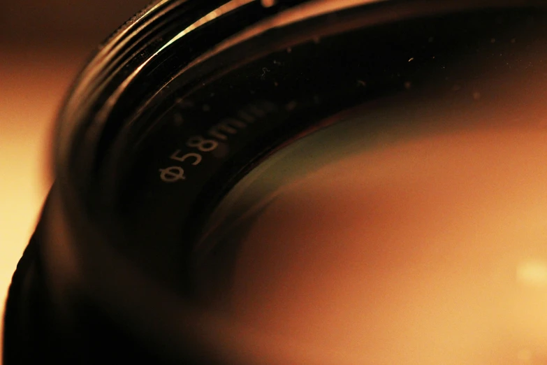an object is seen through the lens on a table