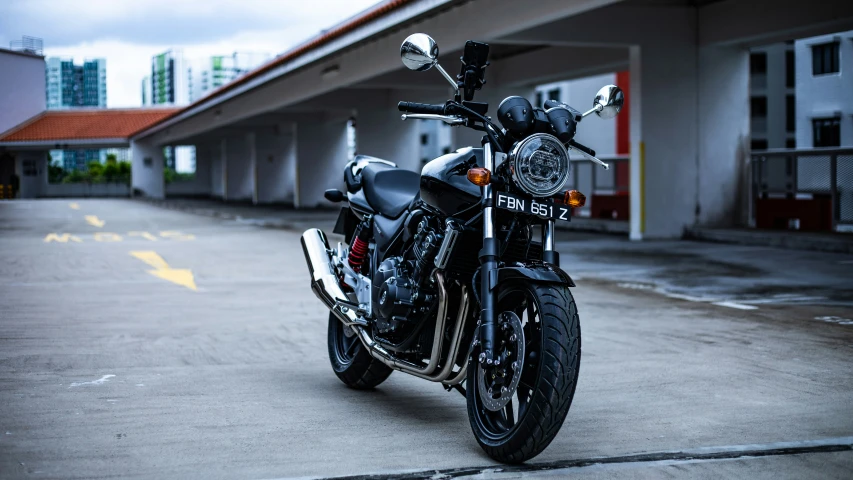 a motorcycle parked outside of a building next to a road