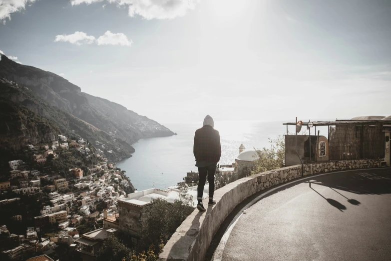 a person standing on the edge of a cliff