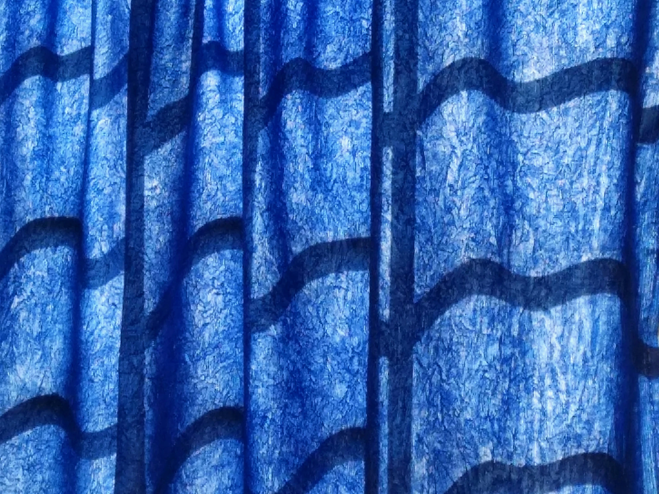 closeup of curtains showing a very blue color