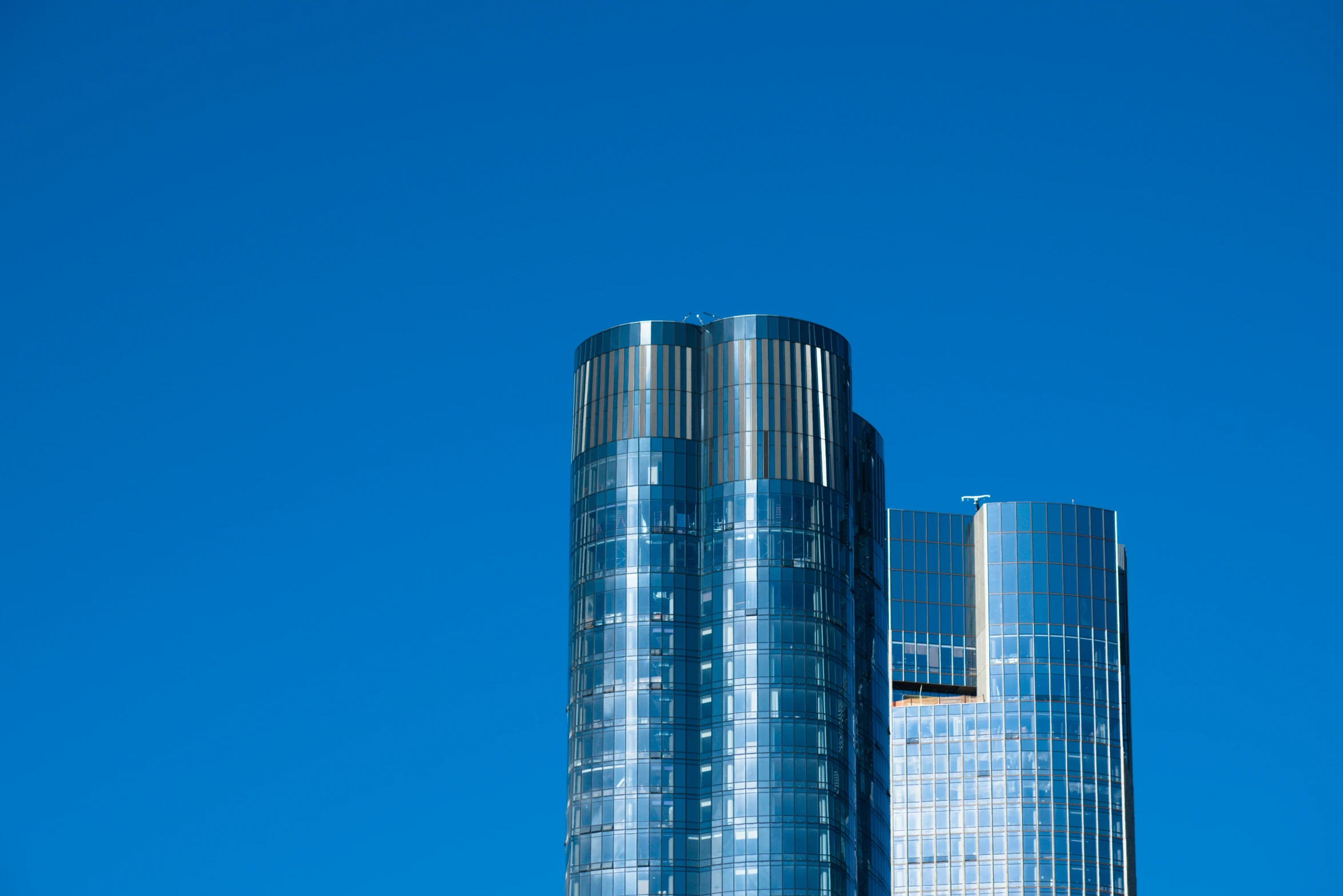 a close up of some very tall glass building