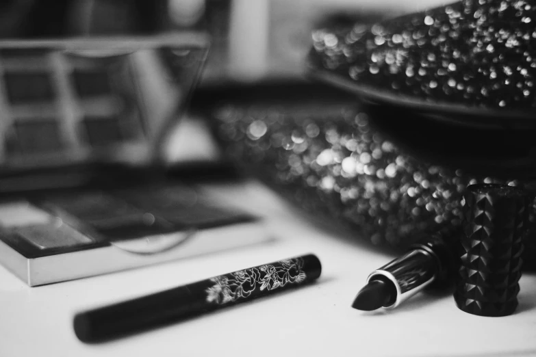 a pair of black and white mascaras on a table