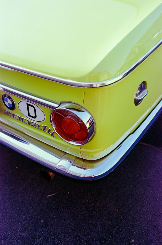 closeup view of the trunk, rear, and ke lights of a classic car