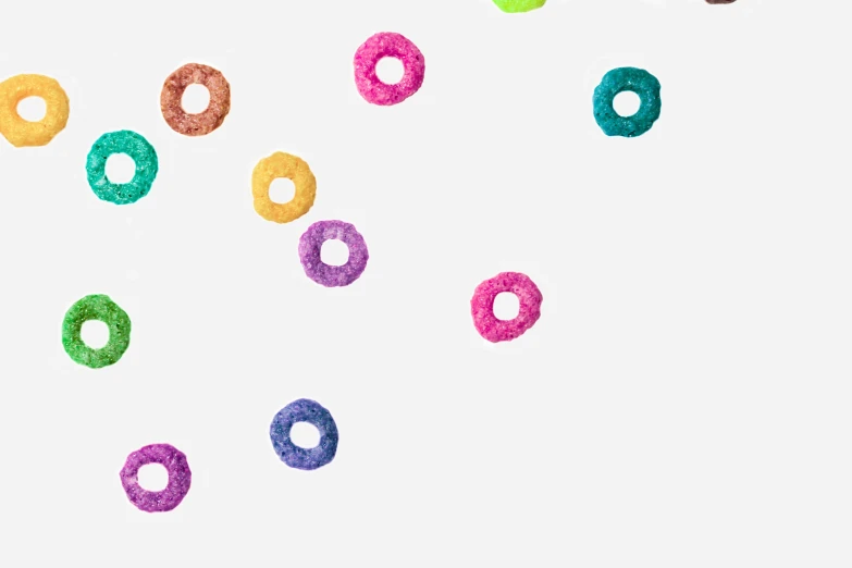 several colorful doughnuts on white background with bubbles