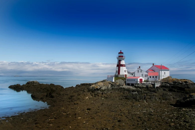 a small lighthouse with a light house on top of it