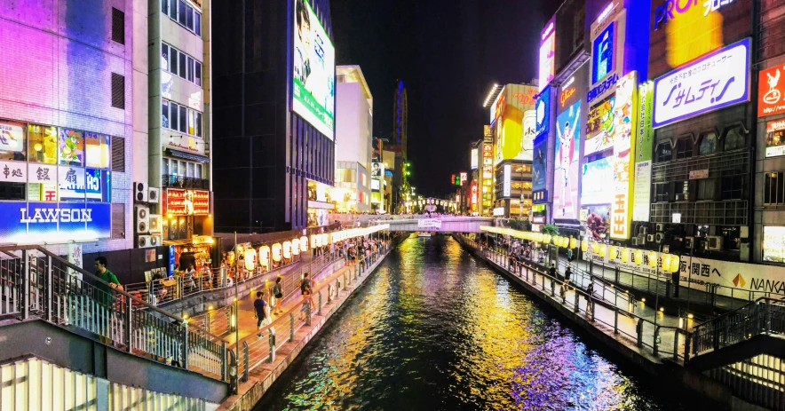 city buildings along a river in an urban area