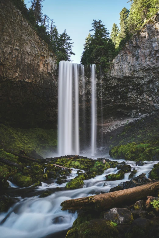 a very big pretty waterfall near some rocks