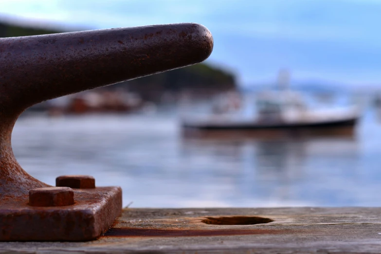 a statue on a dock with a boat in the water