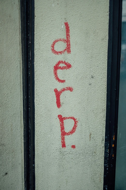 the word leap written in red chalk on a wall