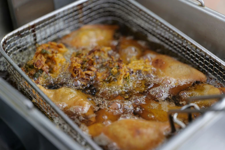 a frying pan filled with food inside of a stove