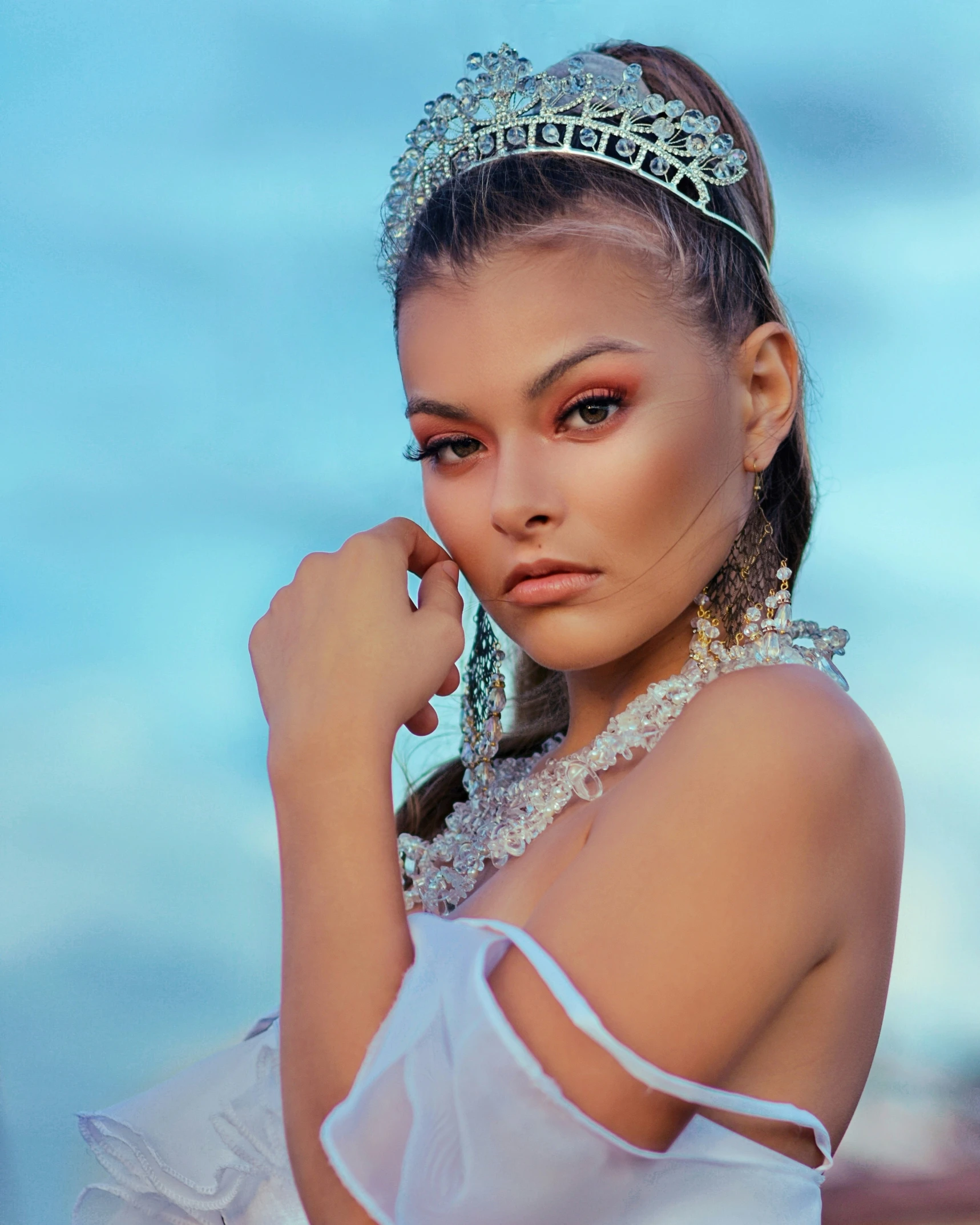 a woman wearing a tiara is posing for a po