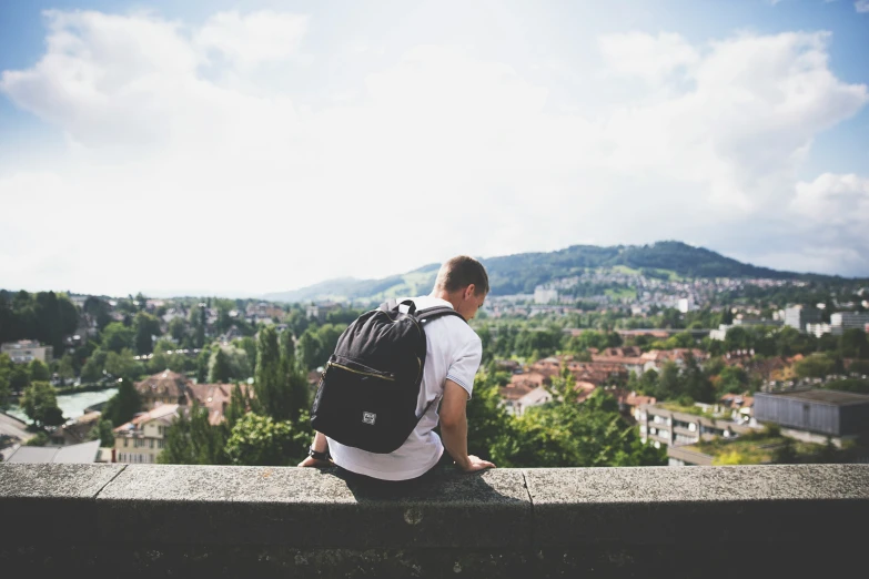 a person looking out at a scenic town