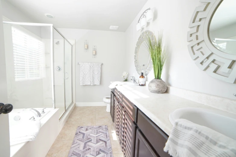 a big white bathroom with tile and shower