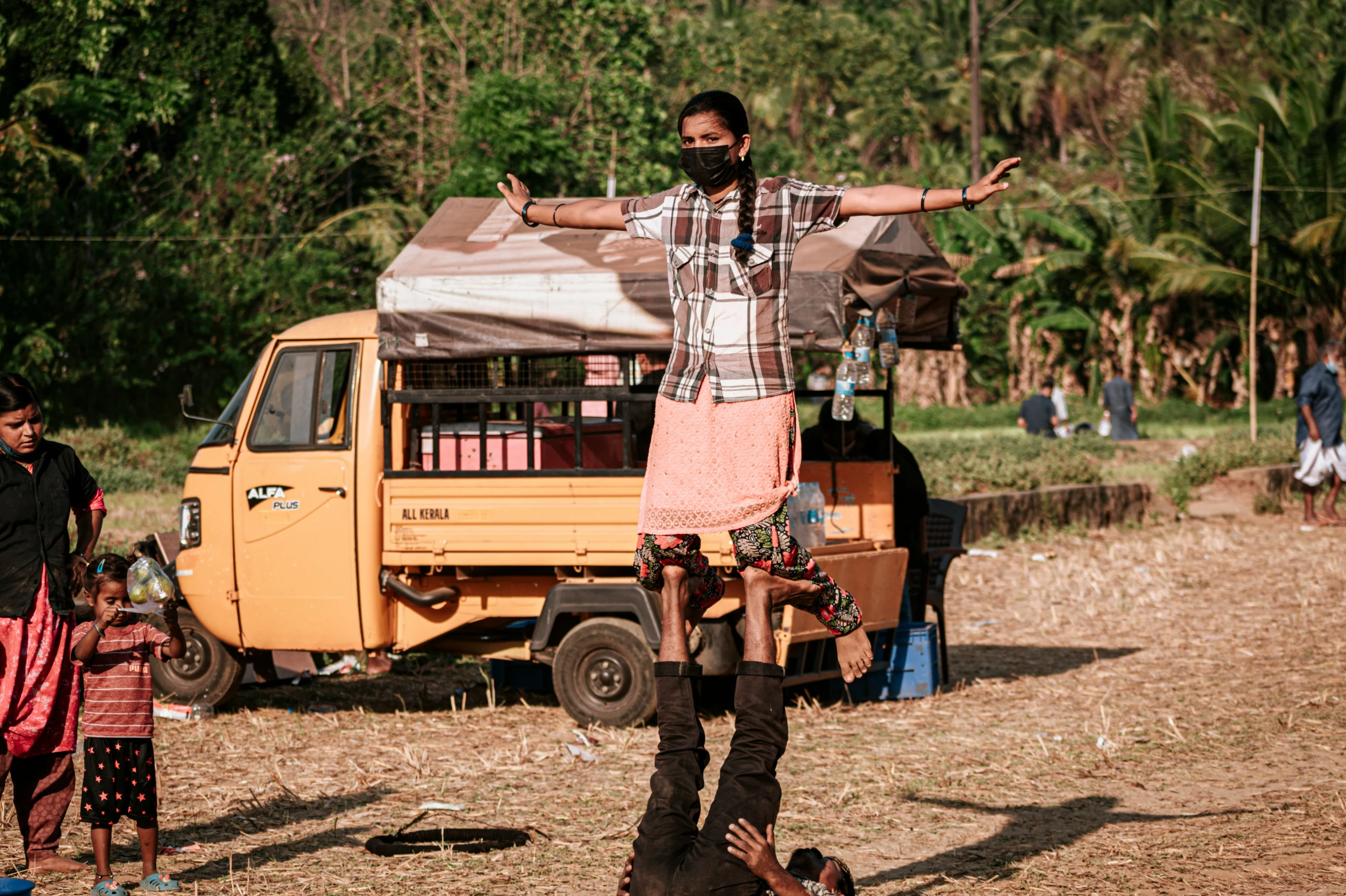 a man wearing a beard is standing on a road