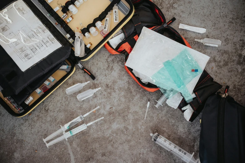 a bag full of medical supplies on the ground