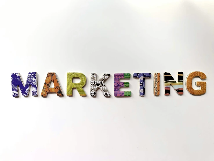 an image of the word marketing written in multicolored letters