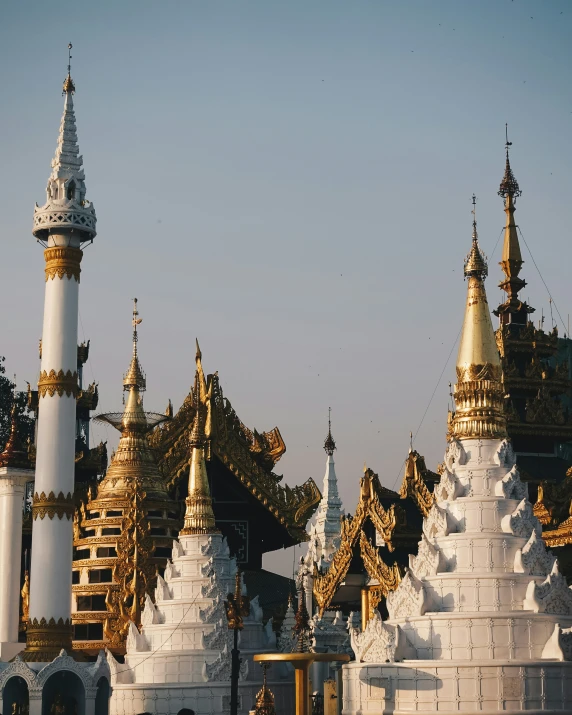 many white and gold buildings near one another