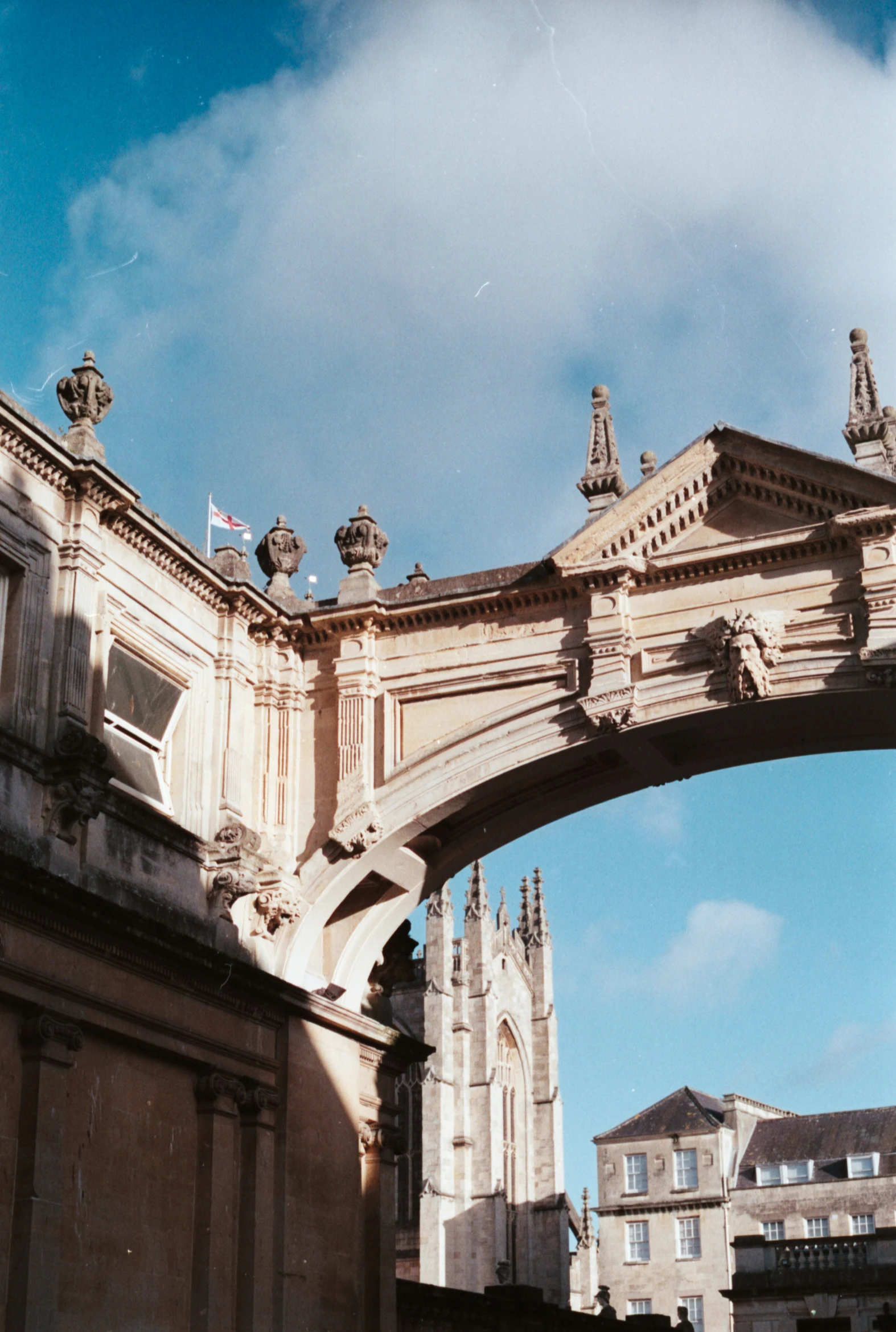 an arch is attached to a building