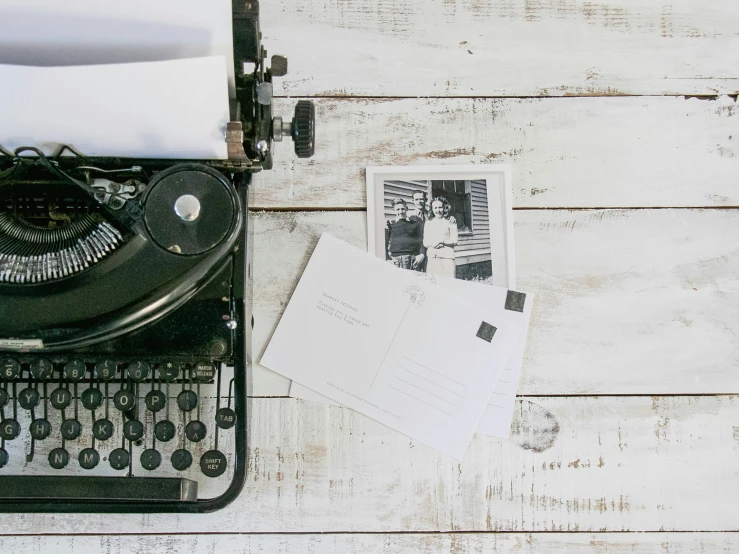 an old fashioned typewriter with several pages on it