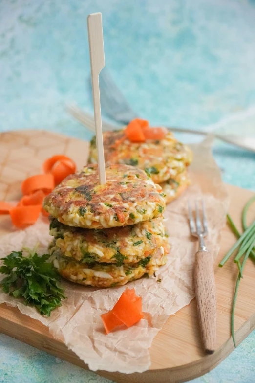 a stack of vegetable patties on top of a  board