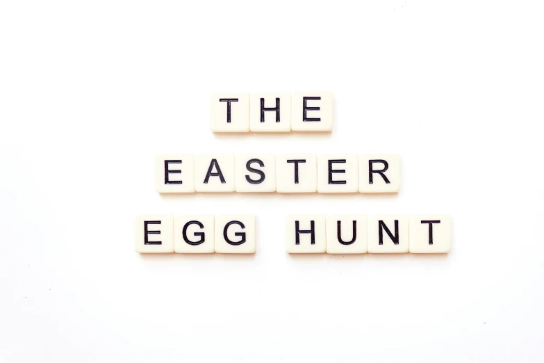 the word the easter egg hunt spelled with scrabble type letters