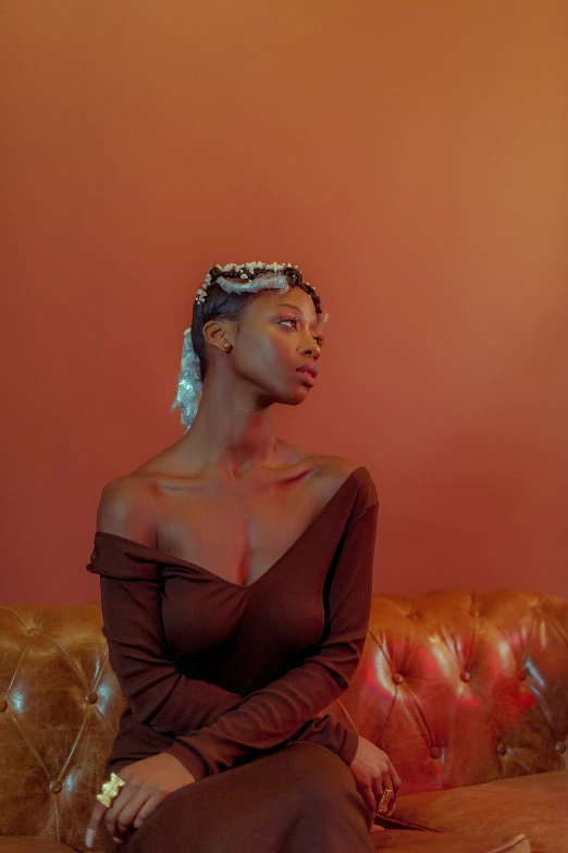 an image of woman sitting on couch with earring