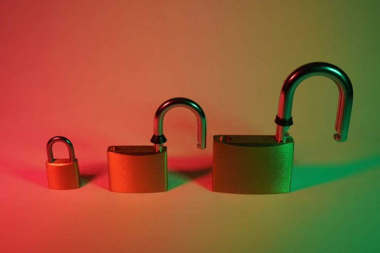 four green and orange padlocks next to each other