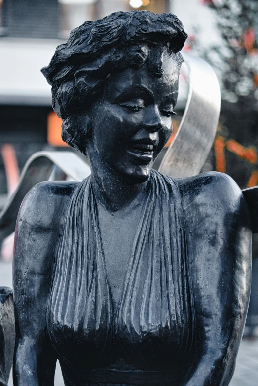 a statue is displayed in front of a building