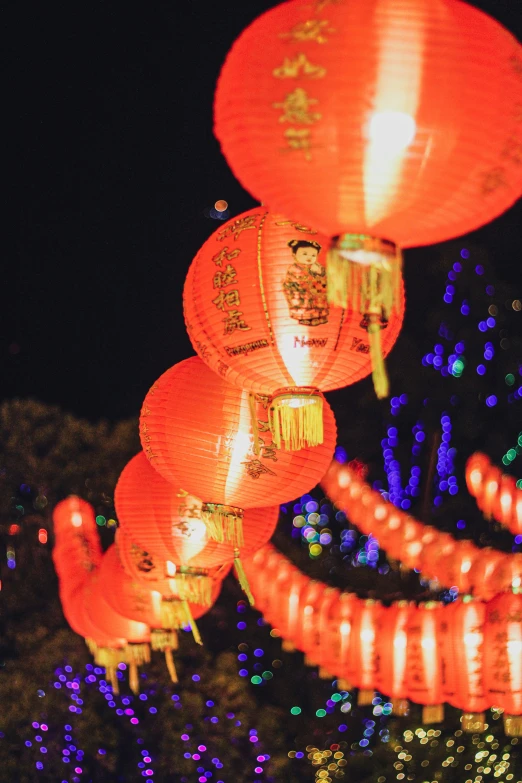 red and yellow paper lanterns glowing in the dark