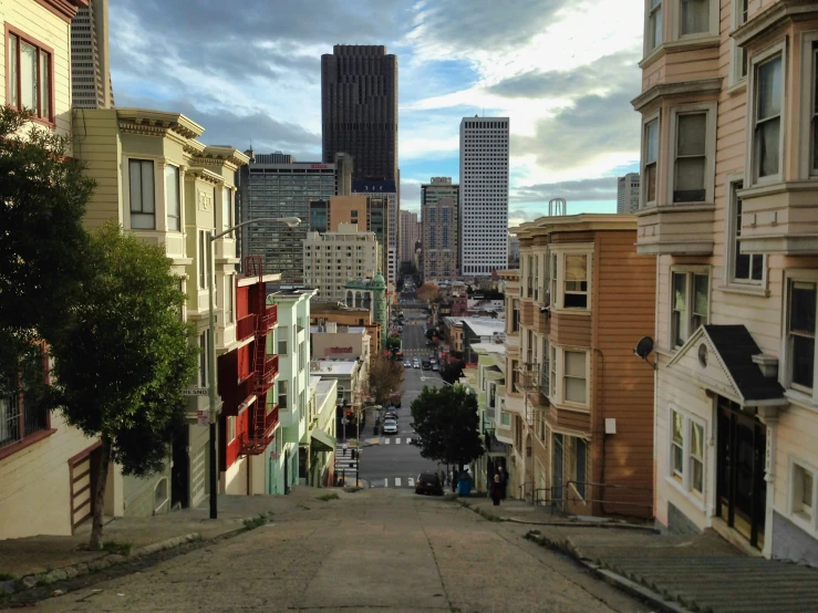 a very narrow street with lots of buildings around it