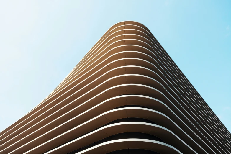 the face of a modern building in front of the sky