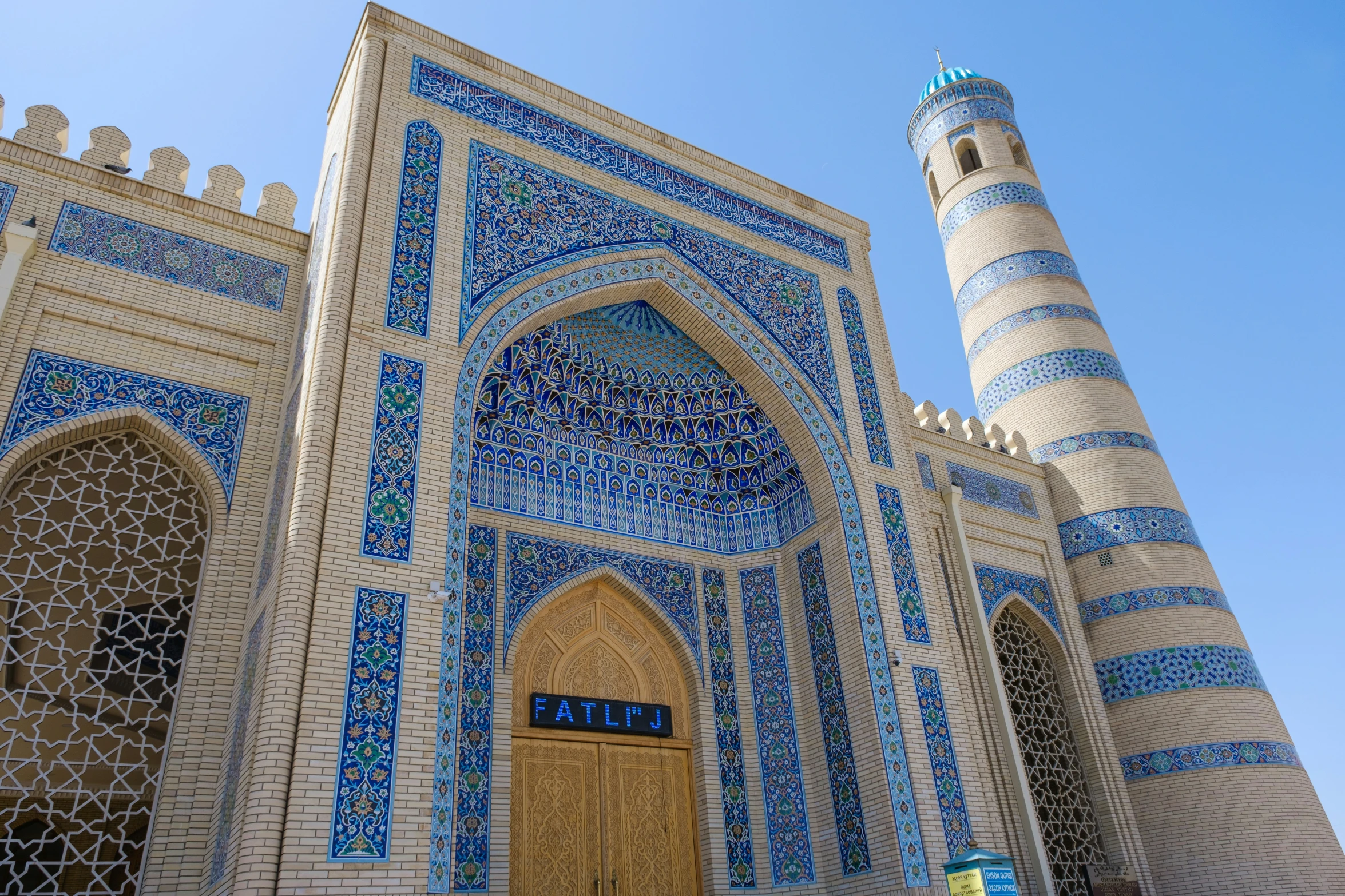 a huge ornate blue and white building with a clock tower