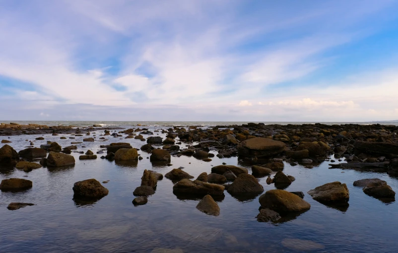 a rocky shore filled with lots of water