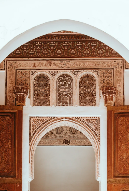 an arch is shown above a doorway with a man standing in it