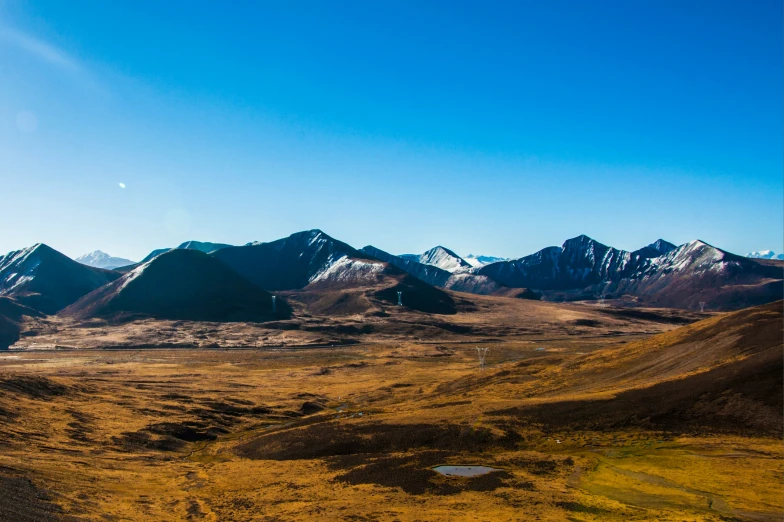 an aerial po of a mountain range in the distance