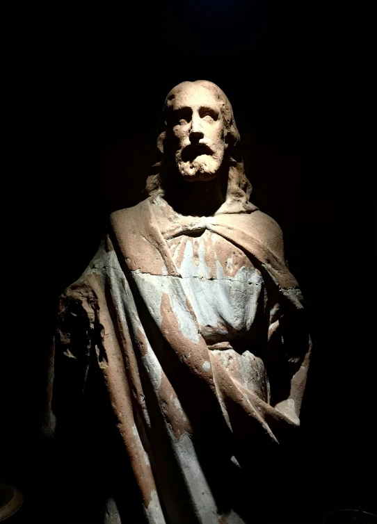 the statue is shown with a light behind it