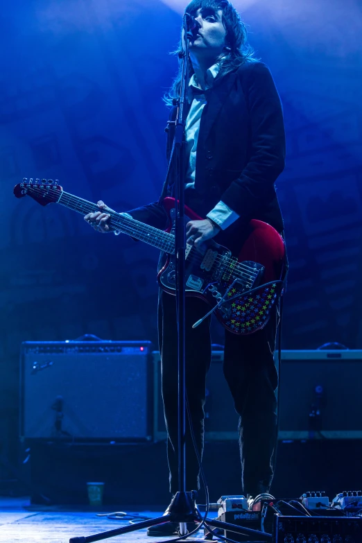 the musician with an electric guitar at a concert