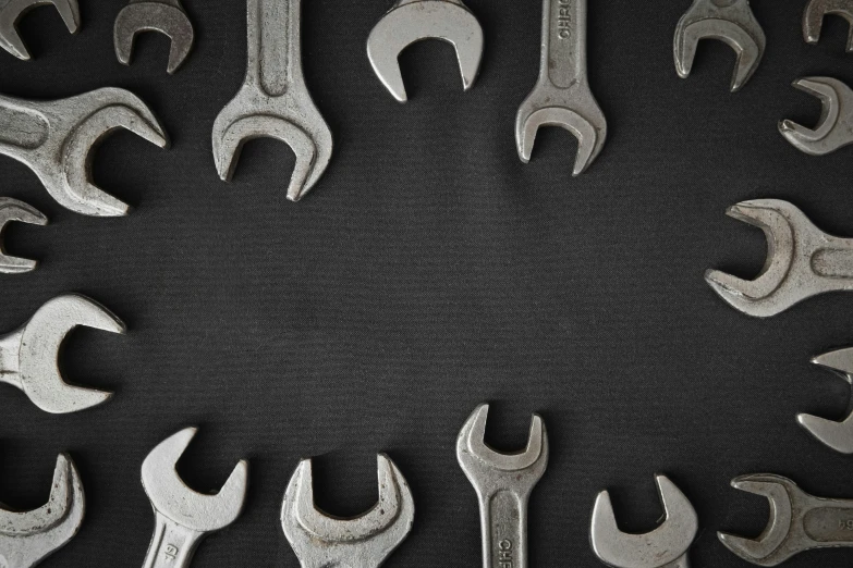 many wrenches with one pointing up to the center