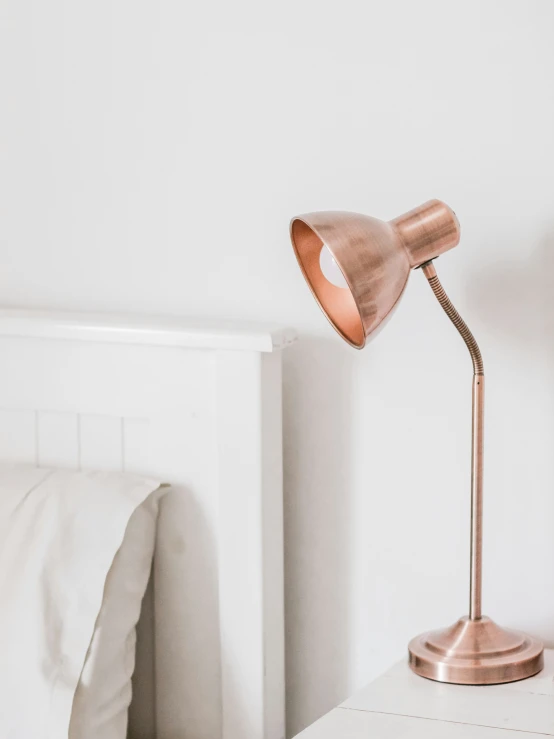 an image of a small copper table lamp