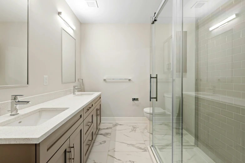 an all white and beige bathroom with tiled walls