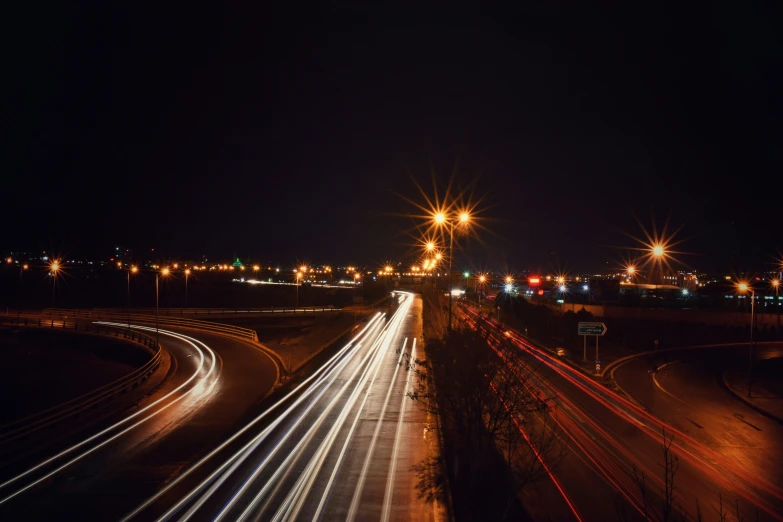 the view down an interstate with car lights