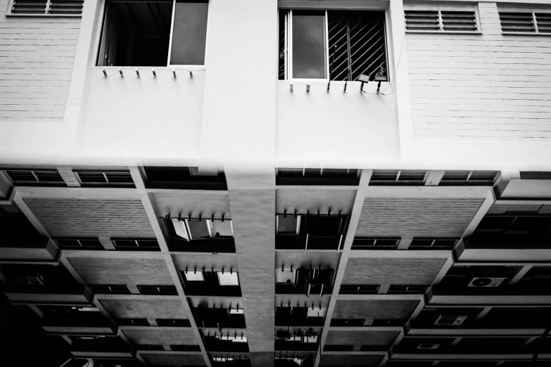 an apartment building with balconies and a clock