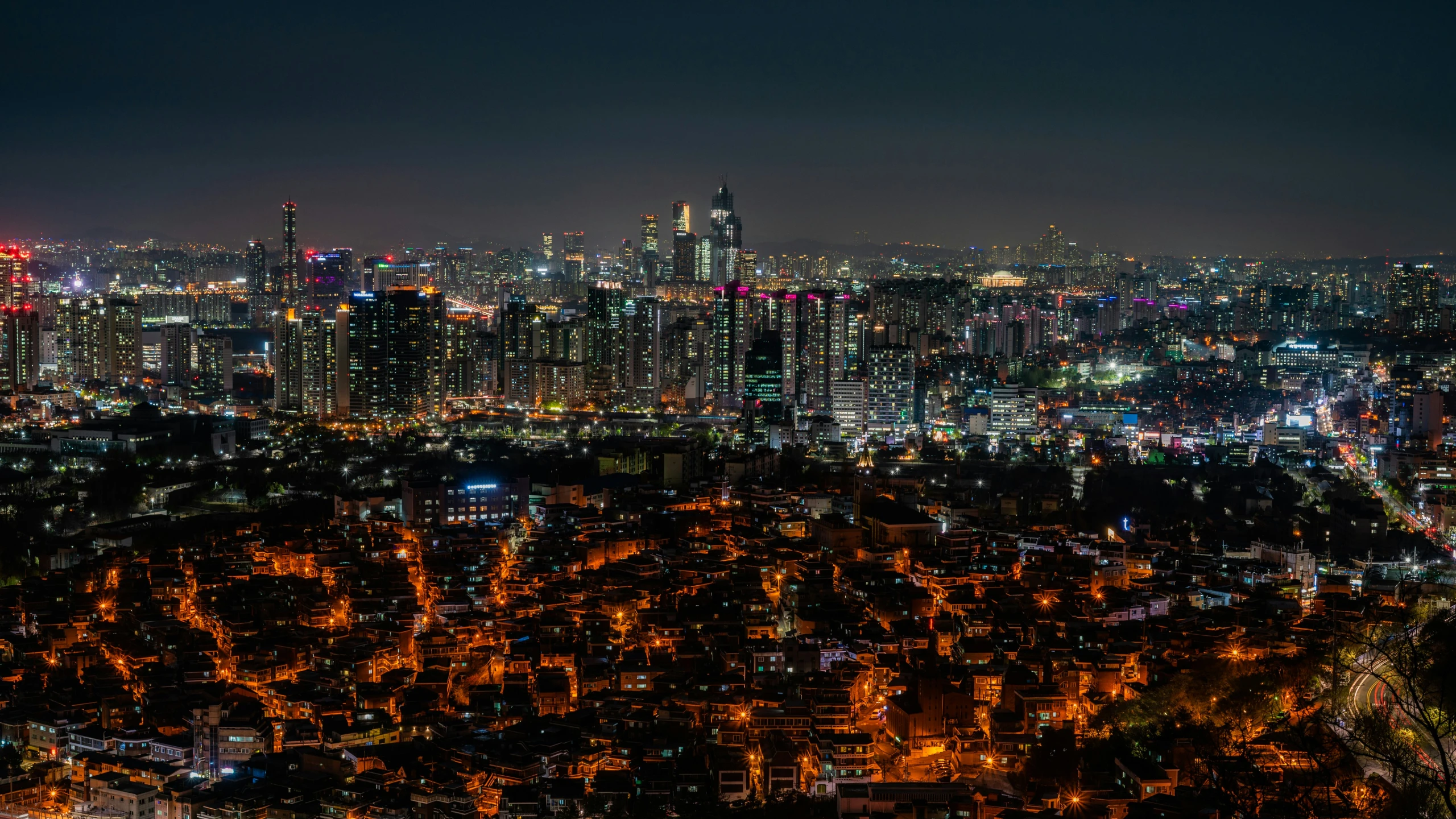 a view of a city from the top of a hill