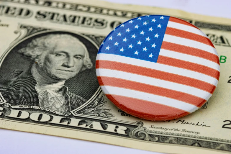 the us dollar is in close contact with the flag of the united states, and the image is close to the two american dollars