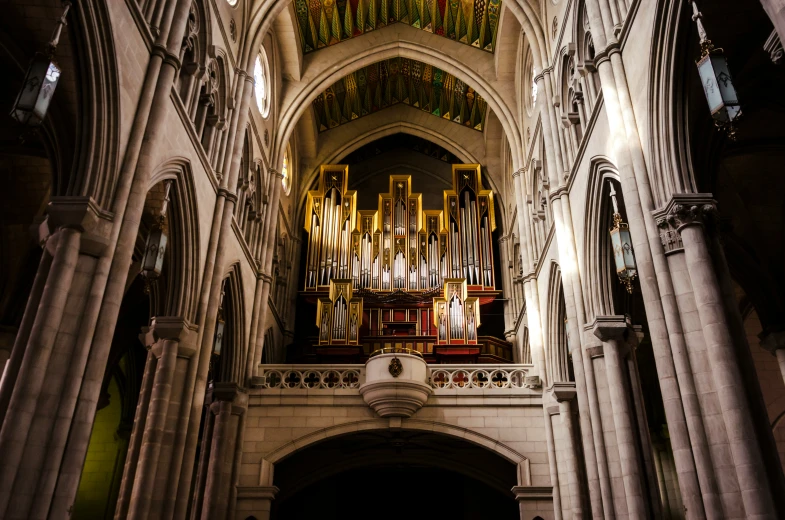 large arched building with an organ mounted to it's side