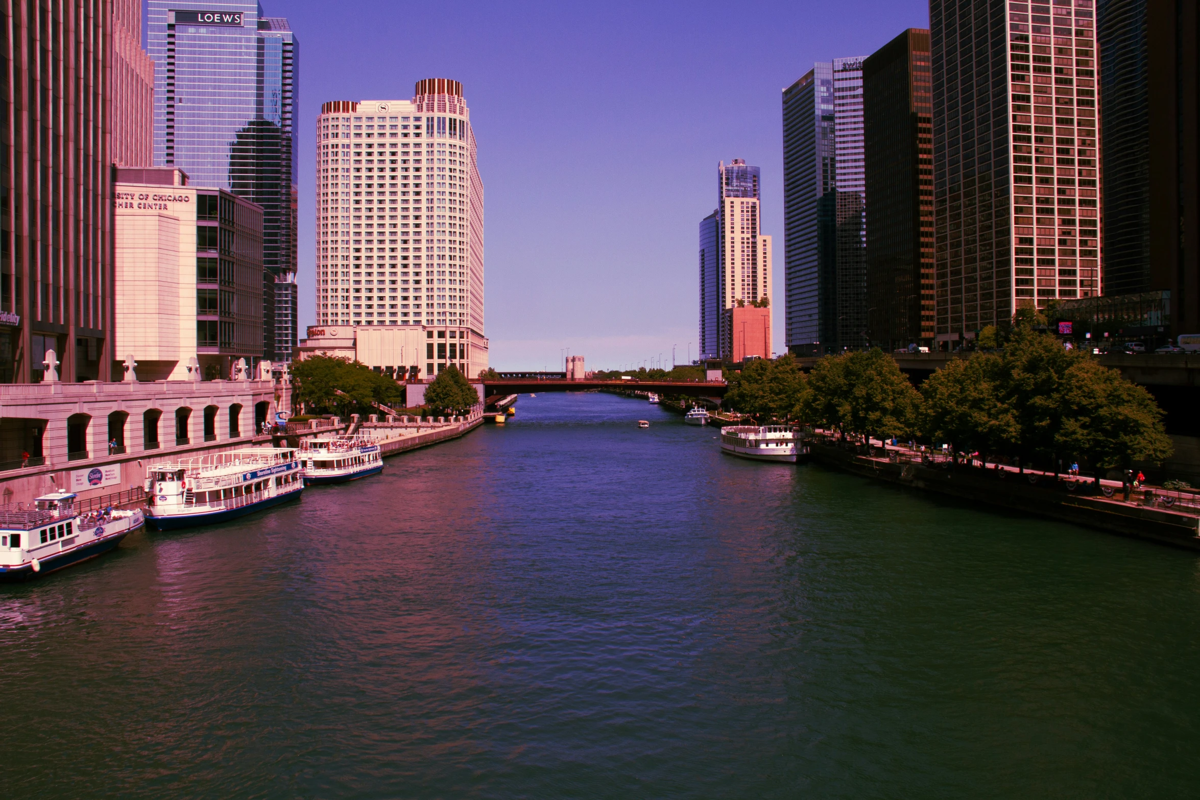 a boat on a canal next to many tall buildings